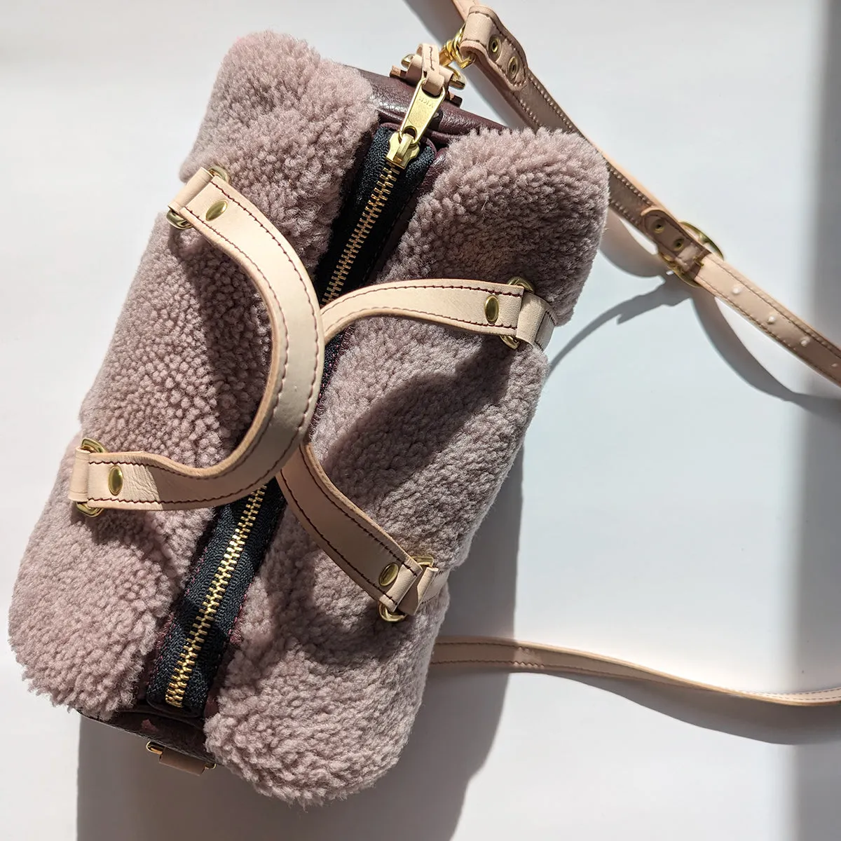 Mini Duffle in Lilac Shearling, Wine, and Vegetable Tanned Leather with Strap