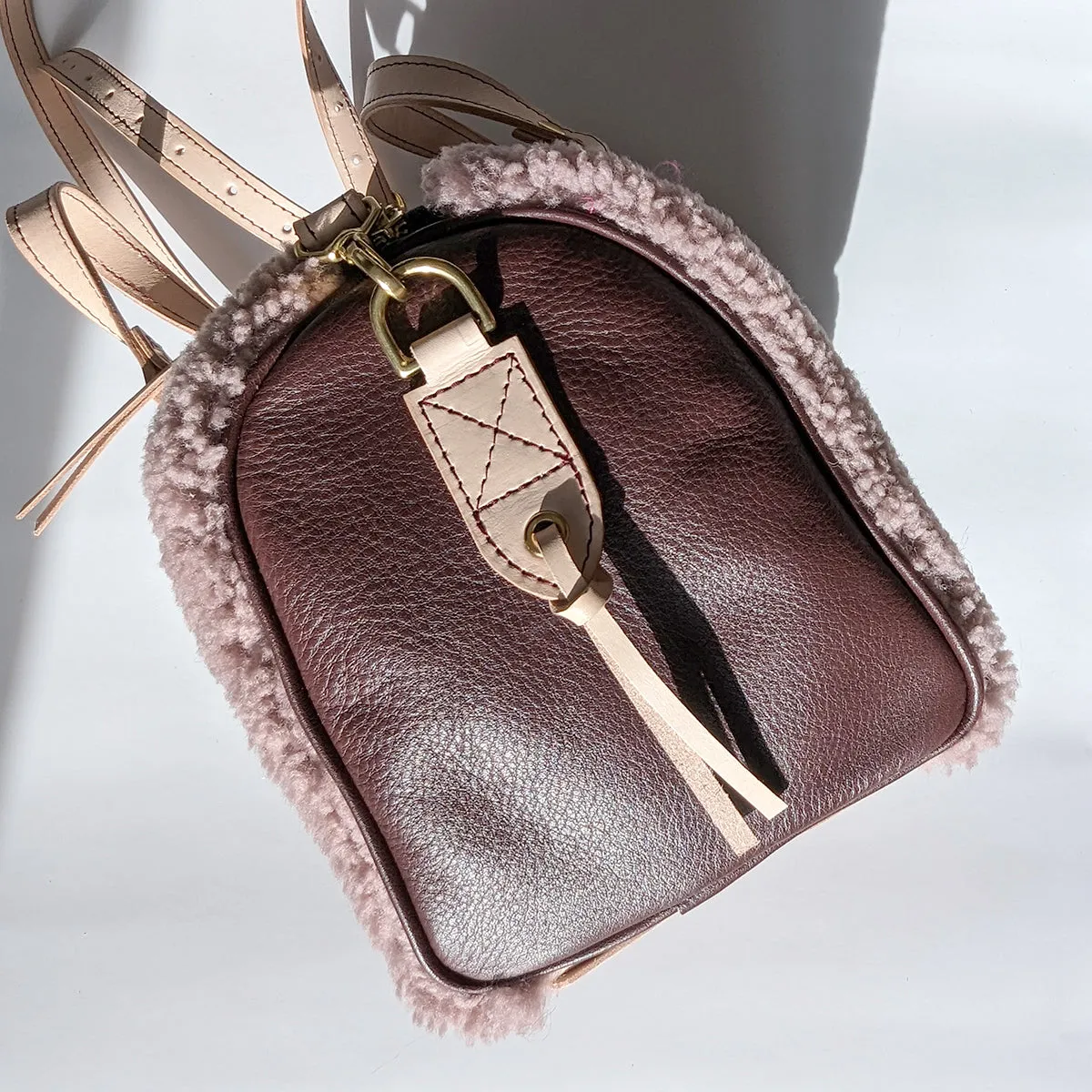 Mini Duffle in Lilac Shearling, Wine, and Vegetable Tanned Leather with Strap