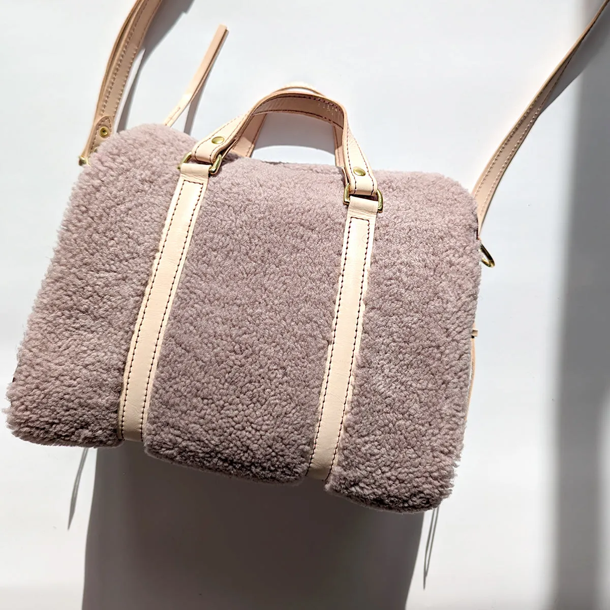Mini Duffle in Lilac Shearling, Wine, and Vegetable Tanned Leather with Strap