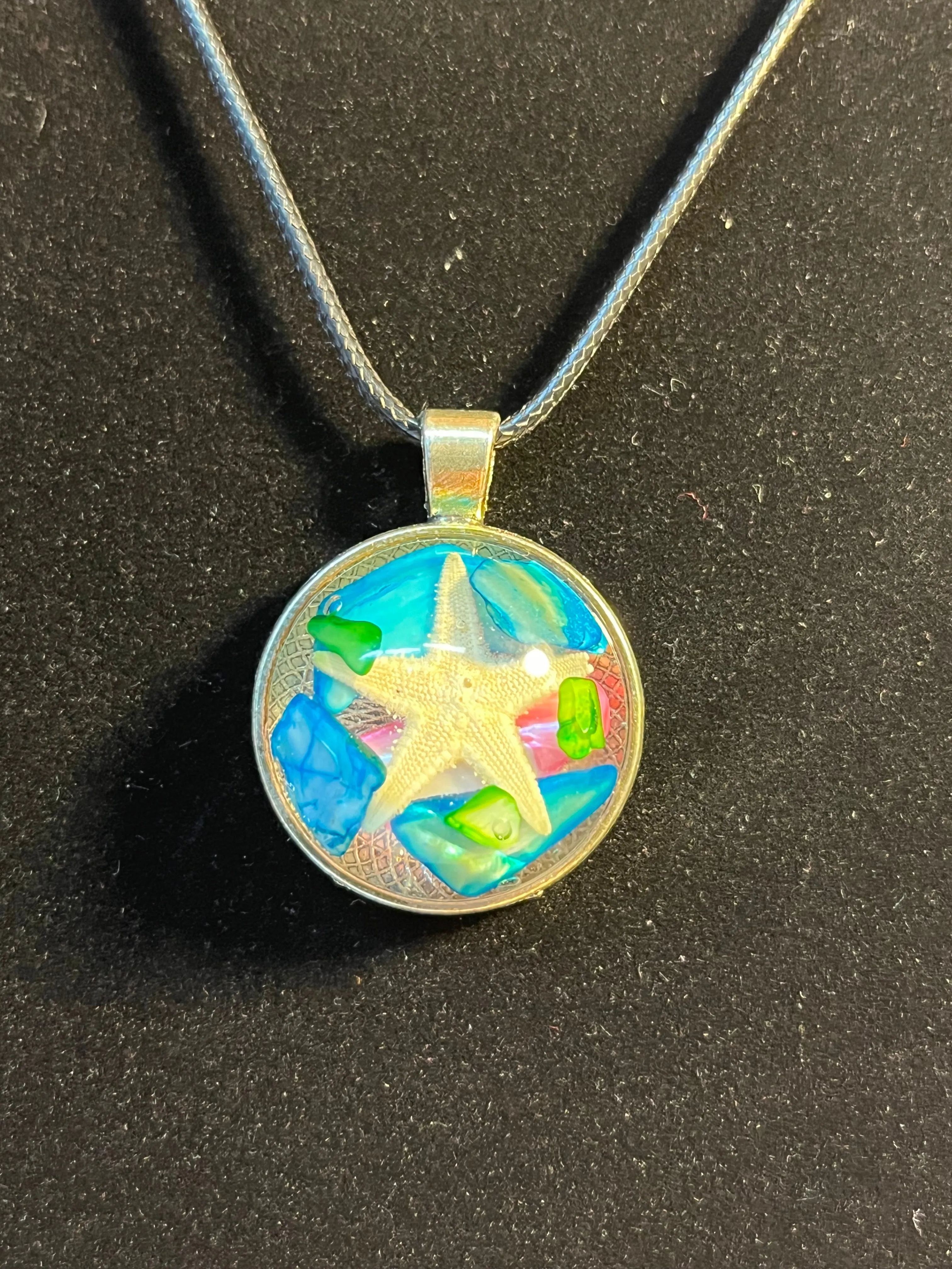Pink, blue & green rock w/ starfish inlaid stone, silver round shaped pendant necklace